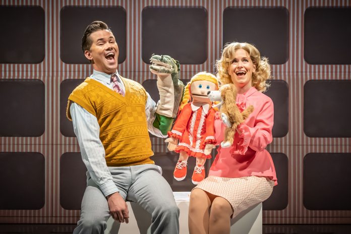 Tammy Faye and husband perform a puppet show in the Almeida's new production of 'Tammy Faye'