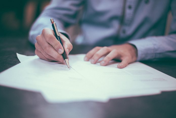 Student completing an exam paper